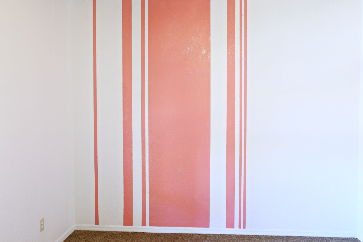 How to paint an asymmetrical striped wall! - Love this room makeover! www.classyclutter.net