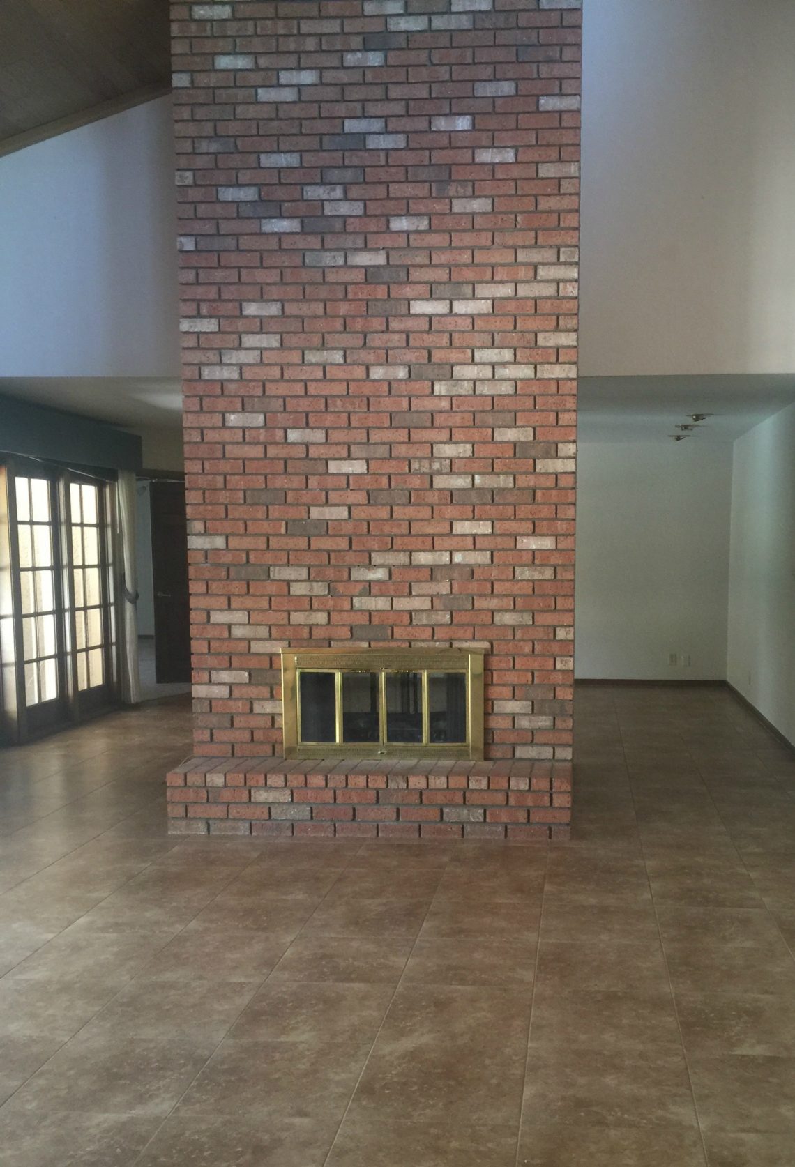 Modern Ranch Reno: How to Re-Grout a Brick Fireplace