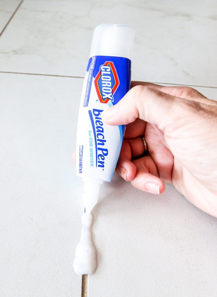 Using a bleach pen to clean grout